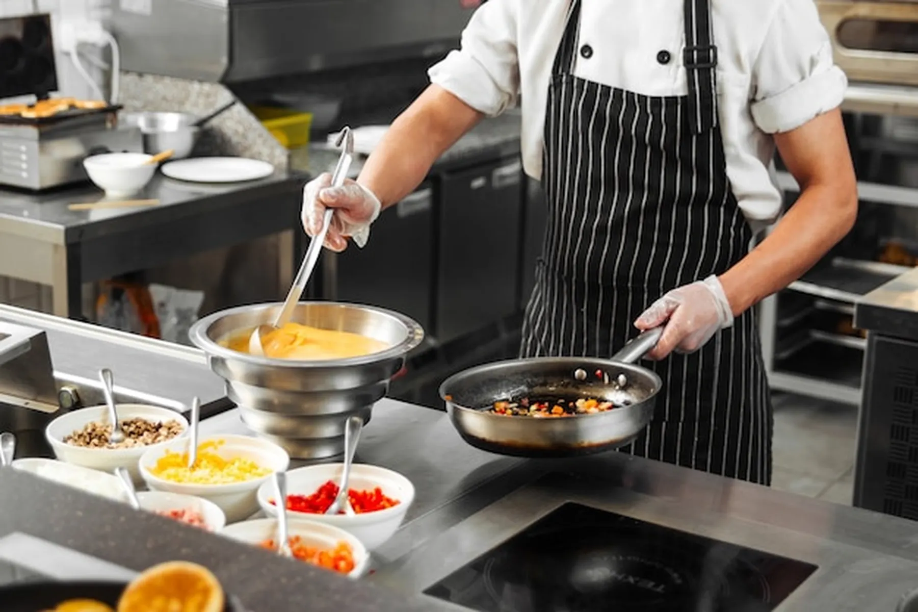chef cooking on indutcion cooker