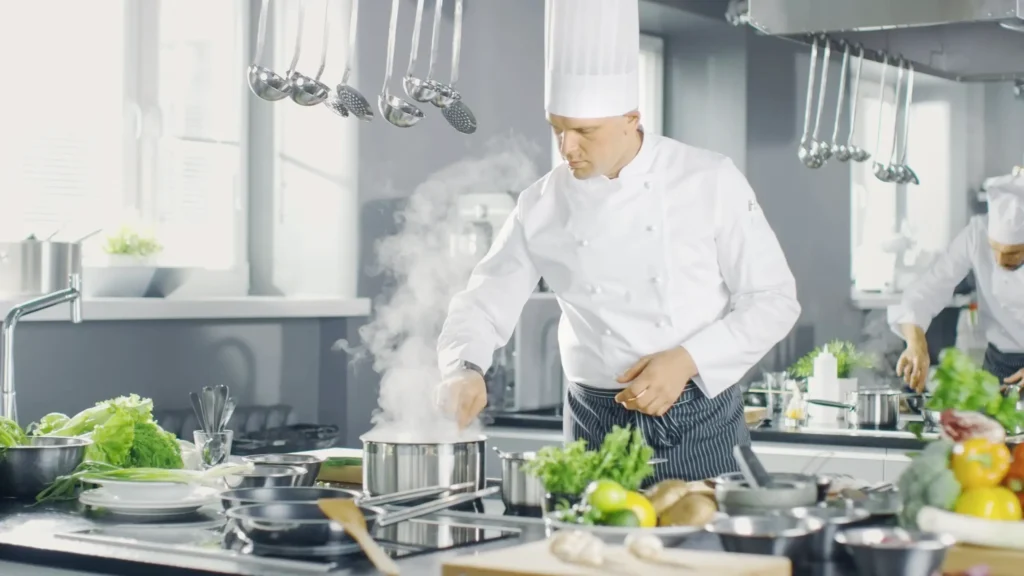 chef cooking with induction station
