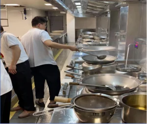 commercial induction wok cooker in kitchen